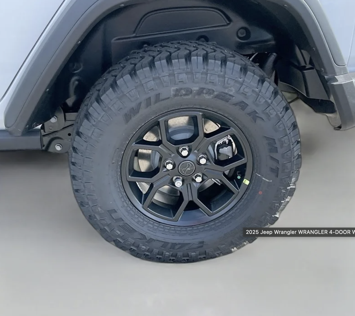 LT285/70R17C BSW mud-terrain tire on a 2025 Jeep Wrangler with black alloy wheel